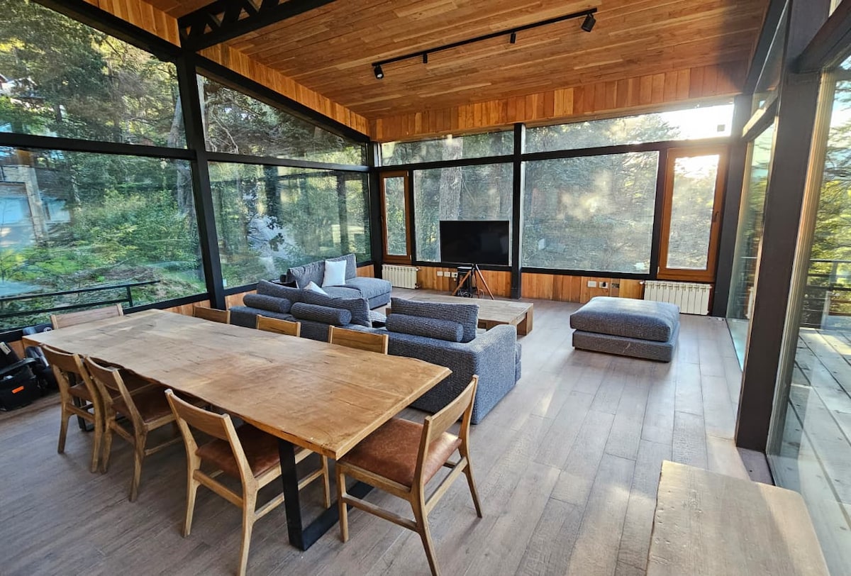 Living room with panoramic forest views
